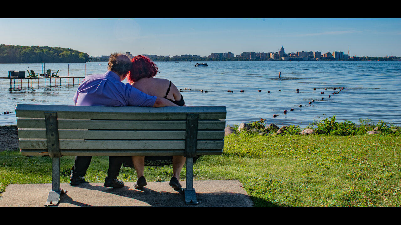 Alex and Danni from behind, looking across Lake Monona towards downtown Madison, WI.